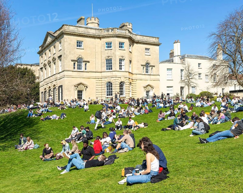 Students on lawn sunbathing, Royal Fort House architect James Bridges 1761, University of Bristol, England, UK
