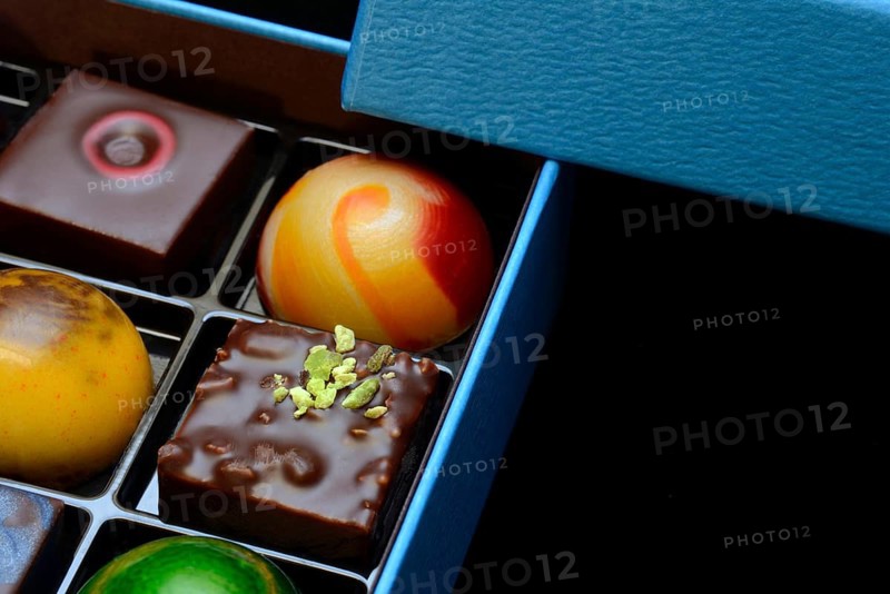 Chocolates in box, black background