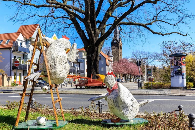 Funny Easter decoration with chickens at Wettinplatz, in the background the New Church Peter and Paul, Coswig, Saxony, Germany, Europe