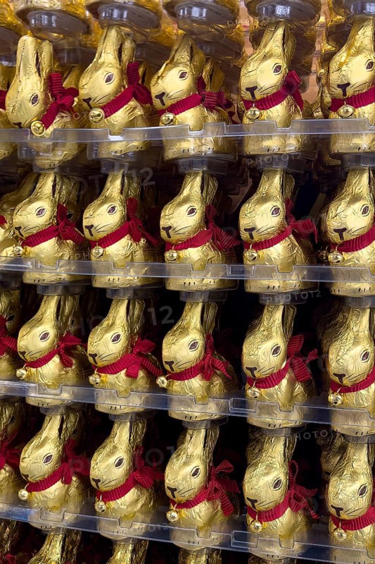 Display on retail shelf of wholesale chocolate Easter bunnies chocolate Easter bunnies chocolate Easter bunnies wrapped in gold-coloured tin foil, Germany, Europe