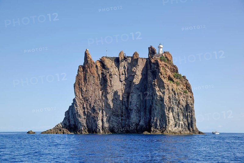 Rock island Strombolicchio with lighthouse, near island Stromboli, Lipari Islands, Tyrrhenian Sea, Italy, Europe
