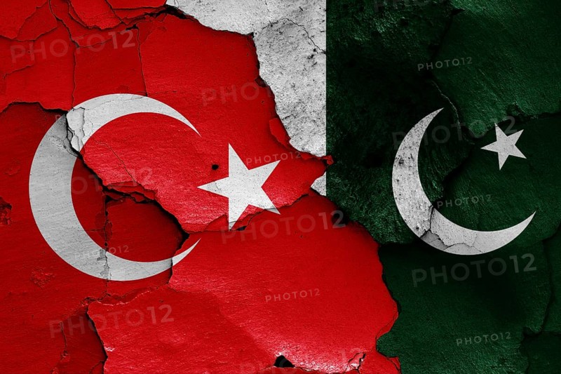 Flags of Turkey and Pakistan painted on cracked wall