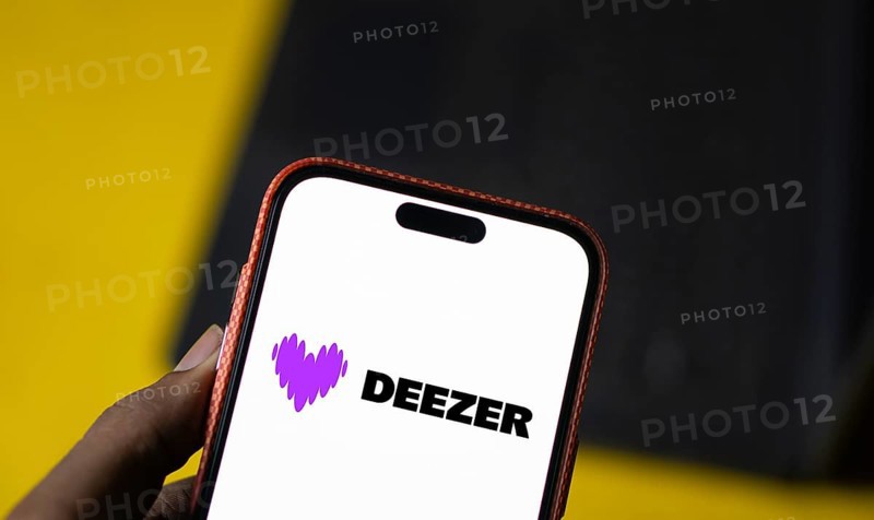 deezer logo is displayed on smartphone. Deezer is a French music streaming service