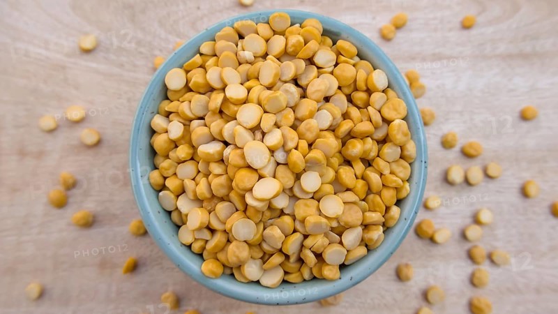Flat Lay of Split Chickpeas Lentils in a Blue Bowl, Top View