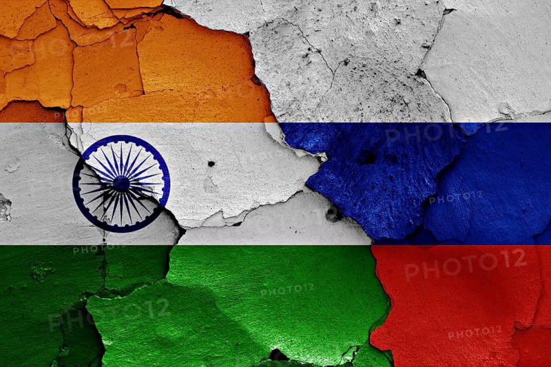 Flags of India and Russia painted on cracked wall