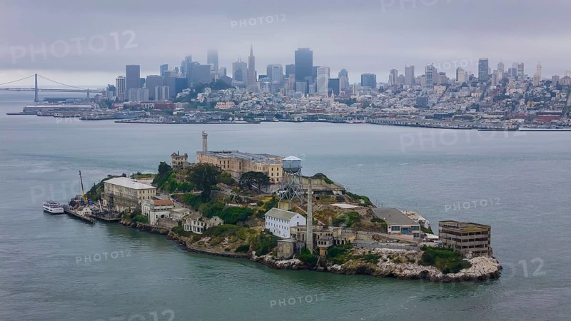 Aerial view of United States Penitentiary, Alcatraz Island, shows a historic maximum-security prison on a small island off San Francisco. Built in 1910-12, it operated from 1934 to 1963 and is now a major tourist attraction