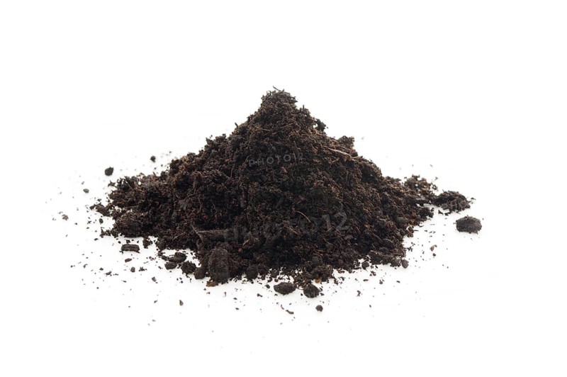 Organic potting soil mix enriched with compost, used in horticulture and gardening. Closeup of an isolated cone pile on white studio background
