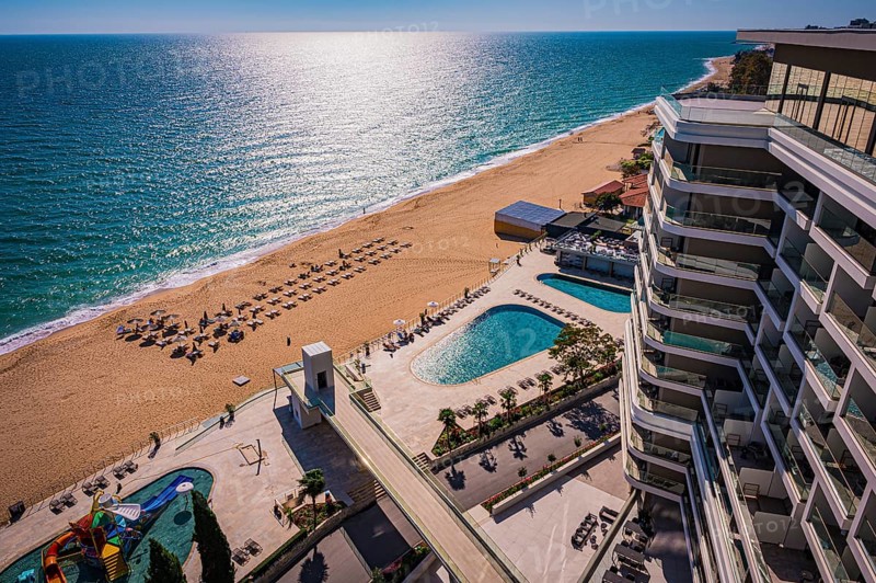 View of a hotel complex with pool on the beach, the Black Sea stretches into the distance, Golden Sands, Varna, Bulgaria, Europe