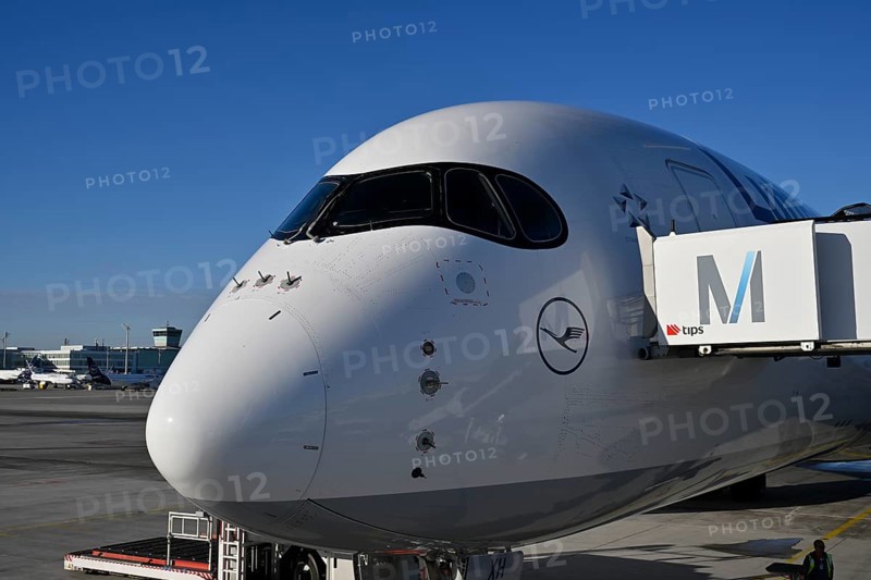 Lufthansa Airbus A350-900, cockpit and cabin with passenger boarding bridge at check-in position in front of Terminal 2 with blue sky, Apron 2 East, Terminal 2, Munich Airport, Upper Bavaria, Bavaria, Germany, Europe