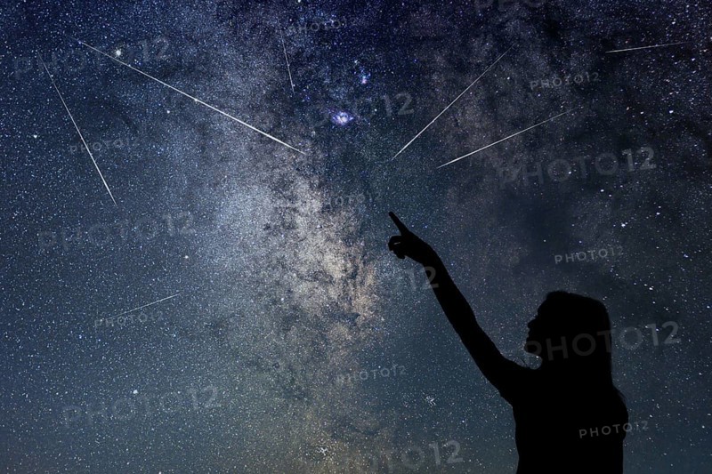 Silhouette of young girl watching Meteor Shower
