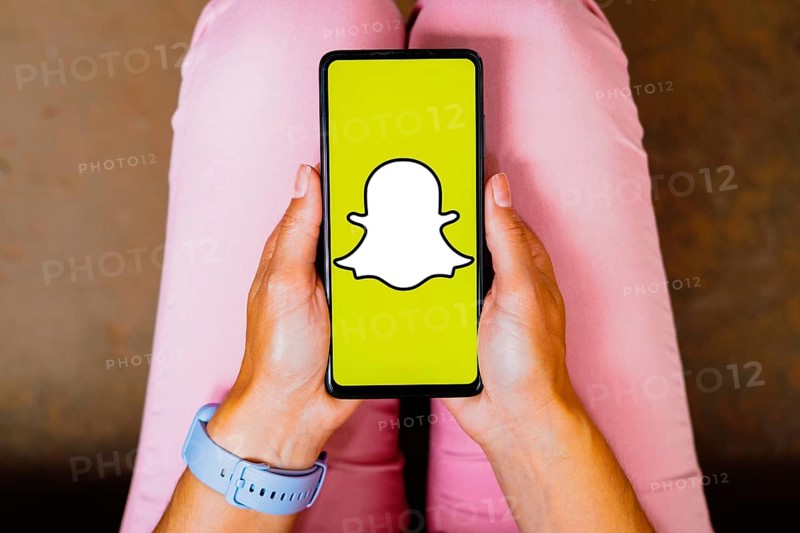 In this photo illustration, the Snapchat logo is displayed on a smartphone screen