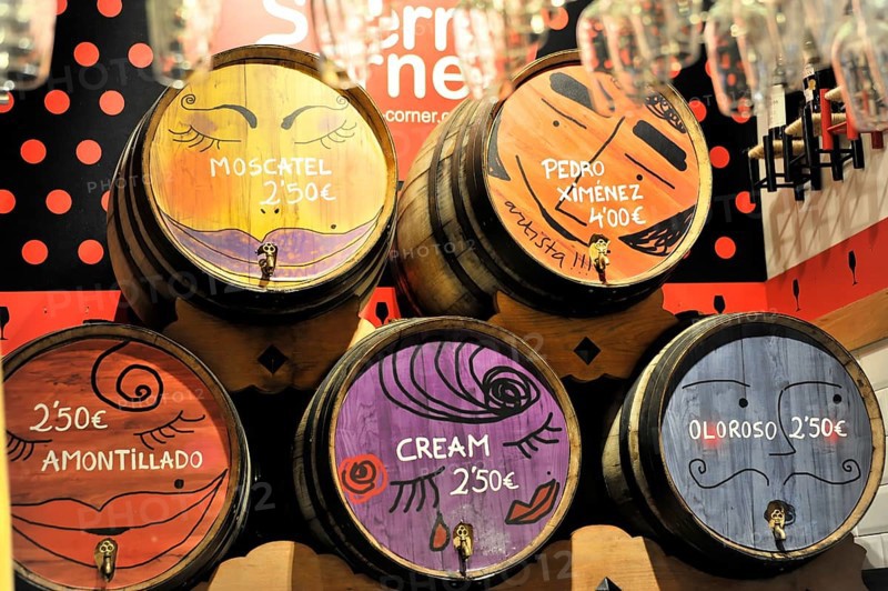 Madrid, Spain, Europe, wooden barrels with colourful painting and price indications in an interior, Europe