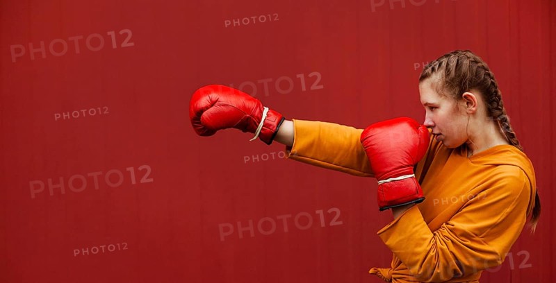 Teenagers posing with boxing gloves