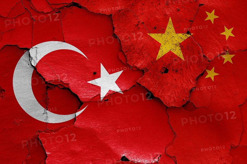 Flags of Turkey and China painted on cracked wall