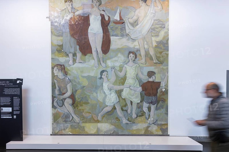 The partial uncovering of the early work in the Deutsches Hygiene-Museum has been completed In the south stairwell foyer of the Deutsches Hygiene-Museum, the large-format mural Lebensfreude (Joy of Life) was created in 1956, with which the then 24-year-old Gerhard Richter completed his studies at the Dresden Academy of Fine Arts. This diploma work, measuring around 63 square metres, was painted over in 1979 and then largely forgotten. After two smaller windows had already been opened in the 1990s, a central section of this historically significant work of art has been uncovered since February 2024 with Gerhard Richter's consent. The result of this complex restoration project can now be viewed. The uncovering was a joint project of the Deutsches Hygiene Museum and the Wüstenrot Foundation in co-operation with the Dresden University of Fine Arts. The accompanying educational measures were supported by the Ernst von Siemens Art Foundation through a
