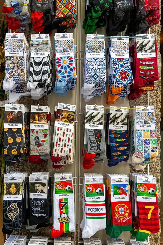 Souvenir gift shop display rack of novelty socks, Guimaraes, northern Portugal