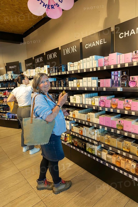 Woman shopping for perfume, Porto Duty Free shops, Aeroporto Francisco Sa Carneiro, Porto airport, Portugal, Europe