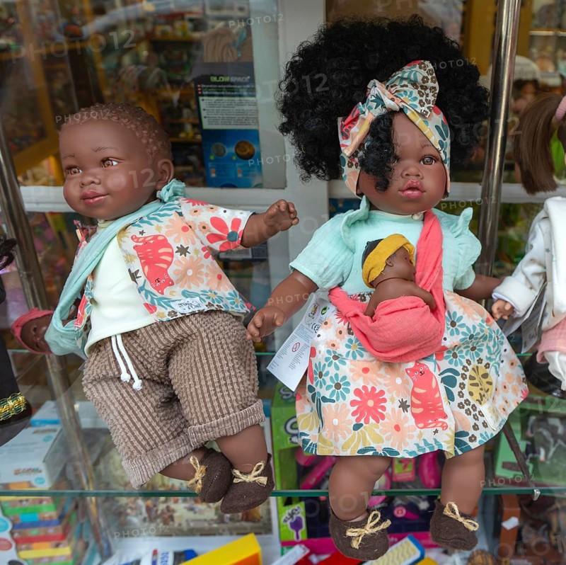 Black skinned baby dolls on display in shop window, city of Guimaraes, northern Portugal