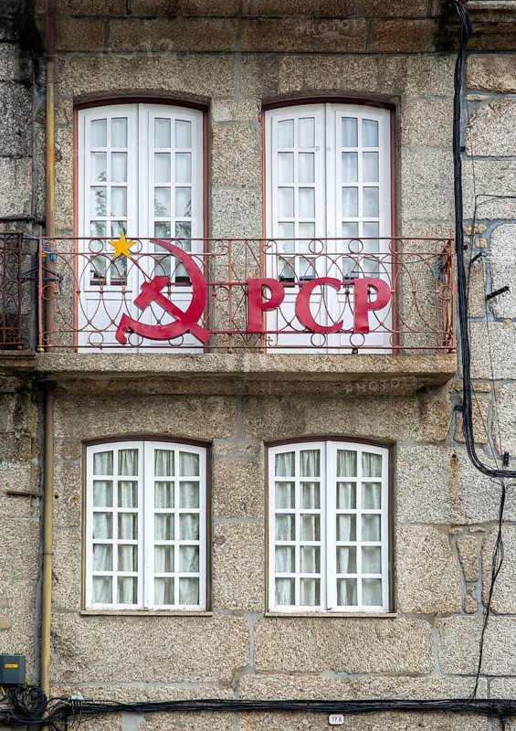 Hammer and sickle sign on PCP Portuguese Communist Party building, city centre Guimaraes. Portugal