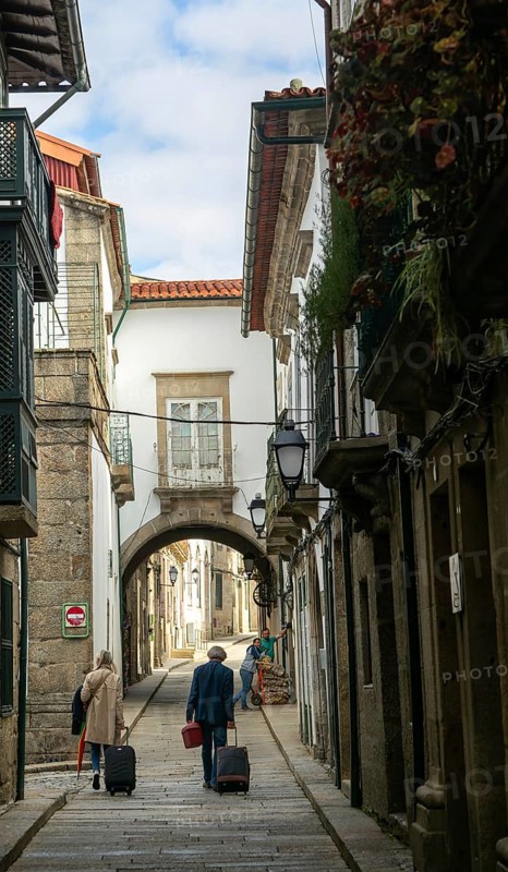 Narrow medieval street Rua de Santa Maria, city centre of Guimaraes, northern Portugal