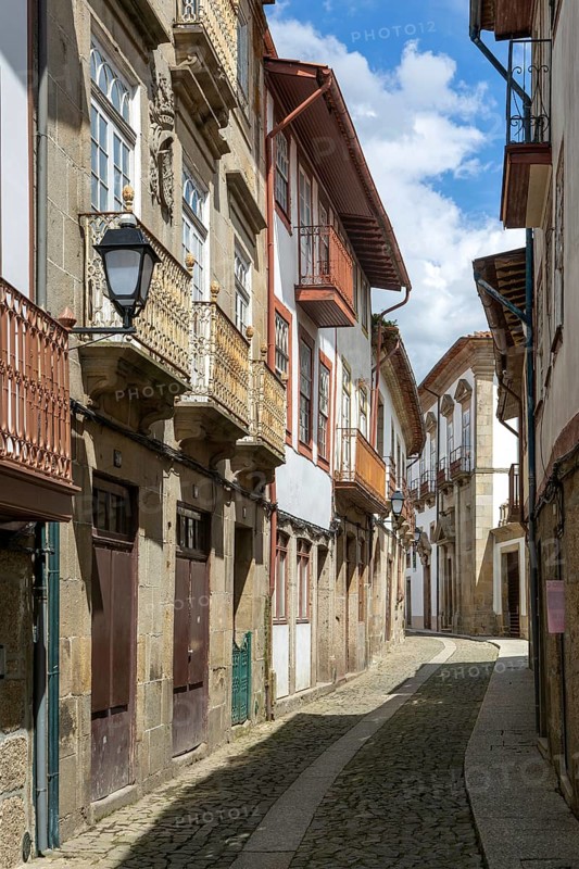 Street of historic buildings with balconies, Rua João Lopes de Faria, city centre Guimaraes, northern Portugal