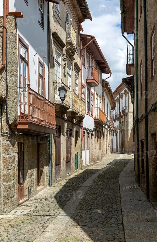 Street of historic buildings with balconies, Rua João Lopes de Faria, city centre Guimaraes, northern Portugal
