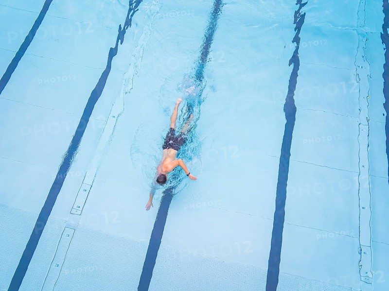 Close-up of a swimmer in motion in a clear pool, Calw outdoor pool, Black Forest, Germany, Europe