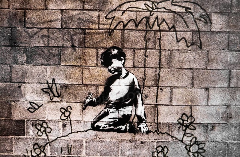 Banksy - Child paints himself a world of flowers, exhibition The World of Banksy