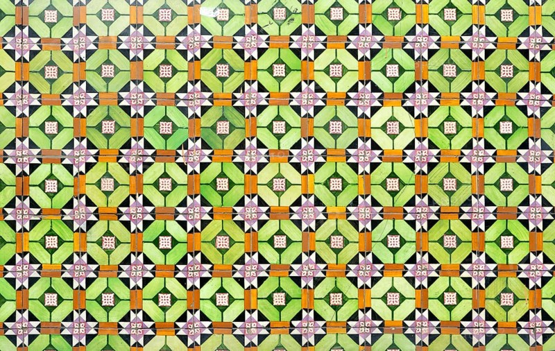 Bright colourful pattern of ceramic tiles on wall of house, Rua das Trinas, Guimaraes, northern Portugal