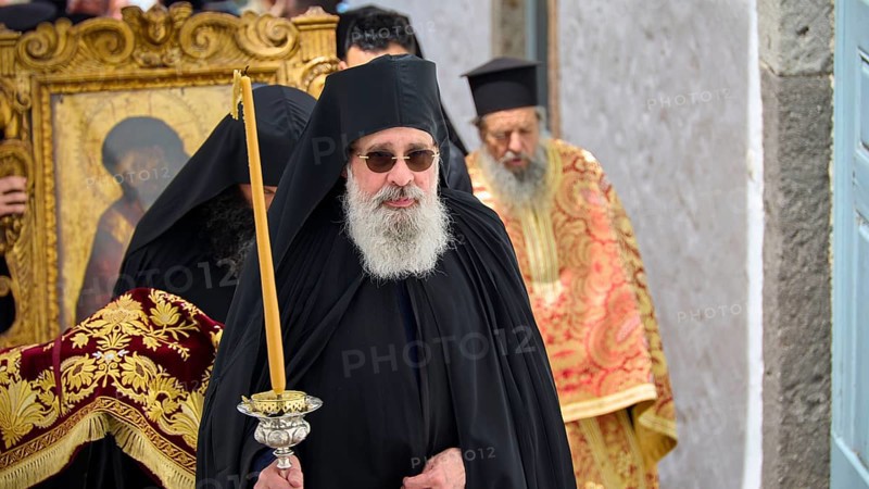 A priest in a black robe carries a candle next to an icon during a religious procession, Orthodox ceremony, monks of St John's Monastery, ceremonial washing of feet, procession, Maundy Thursday, Megali Pempti, Chora, Patmos, Dodecanese, Greek Islands, Greece, Europe