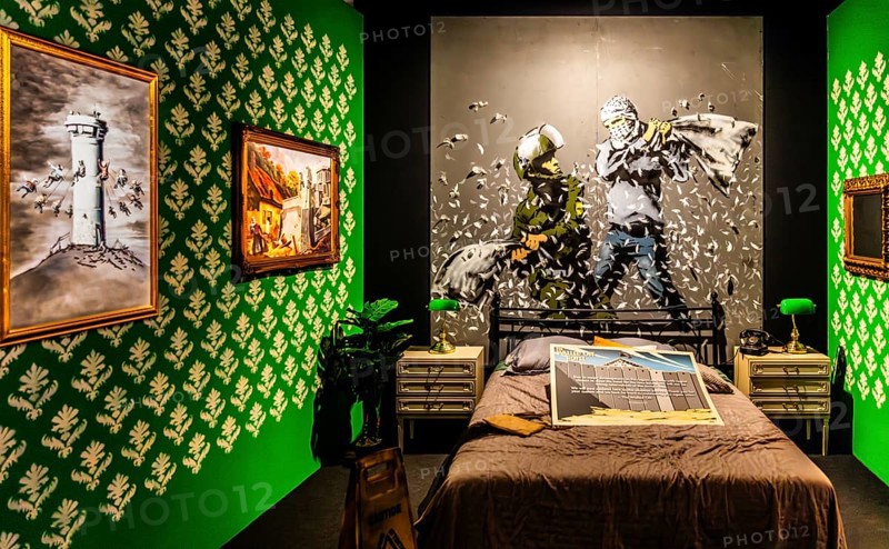 Banksy - The Walled Off Hotel, ironically artistically designed rooms right next to the controversial wall, 2023, Bethlehem, West Bank, exhibition The World of Banksy