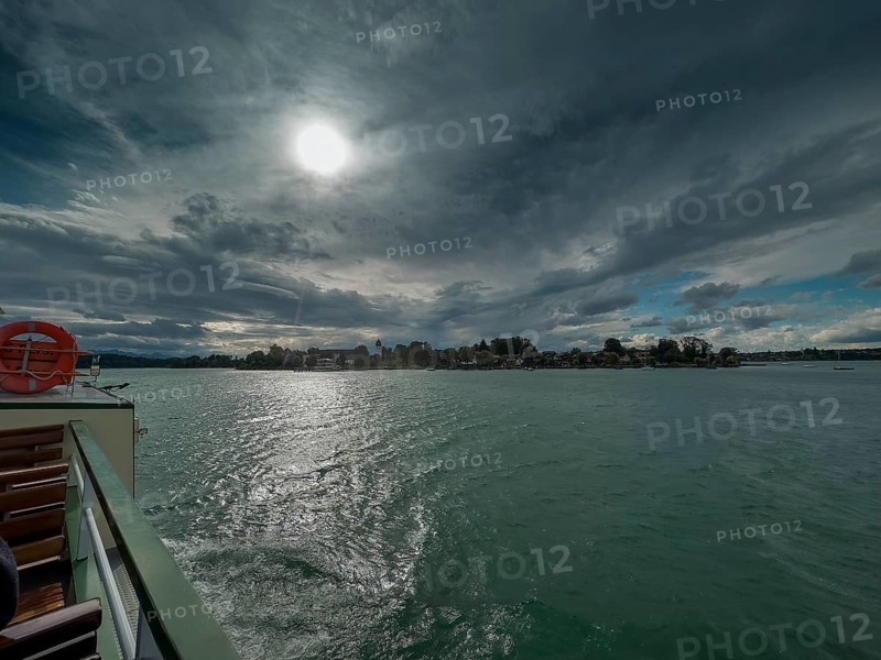 Dark clouds over the Chiemsee, view of the Fraueninsel, Bavaria, Germany, Europe