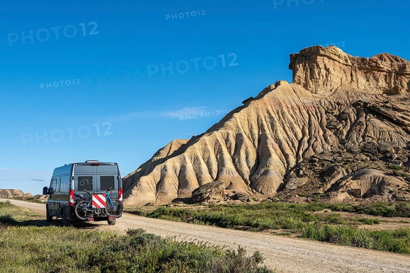 Colorful rock formation, camper van, semi-desert, Bardena Blanca area, Bardenas Reales Nature Park, Navarre, Spain, Europe