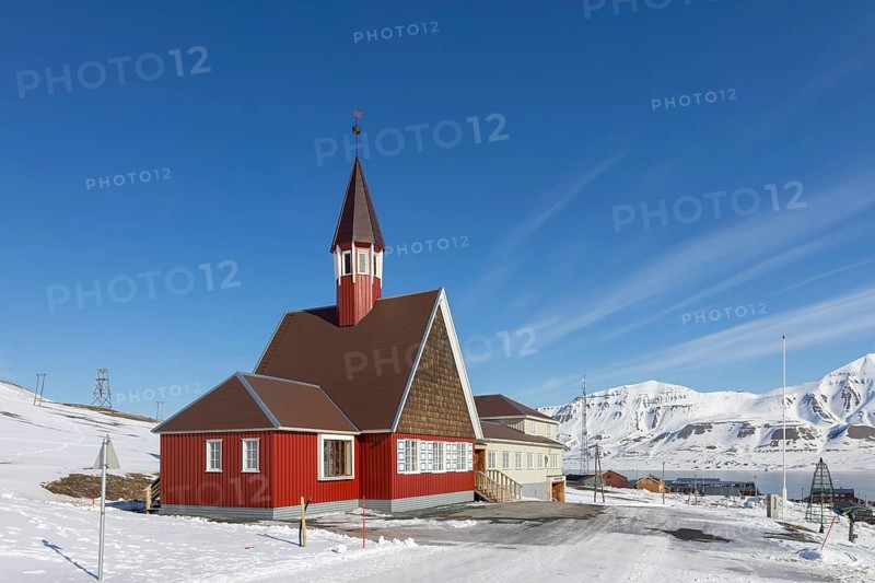 1958 red wooden Evangelical Lutheran Svalbard Church in the town Longyearbyen in winter, Spitsbergen, Norway, Europe