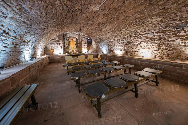 Stone vaulted cellar with benches and warm light, rustic and historic atmosphere, registry office, family celebration in Neubulach, district of Calw, Germany, Europe