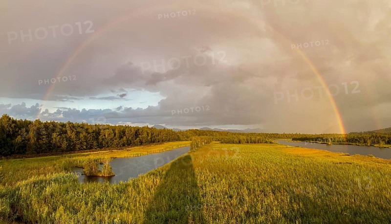 Complete and partial double rainbow in the Ainringer and Peracher moss nature reserve, Bavaria, Germany, Europe