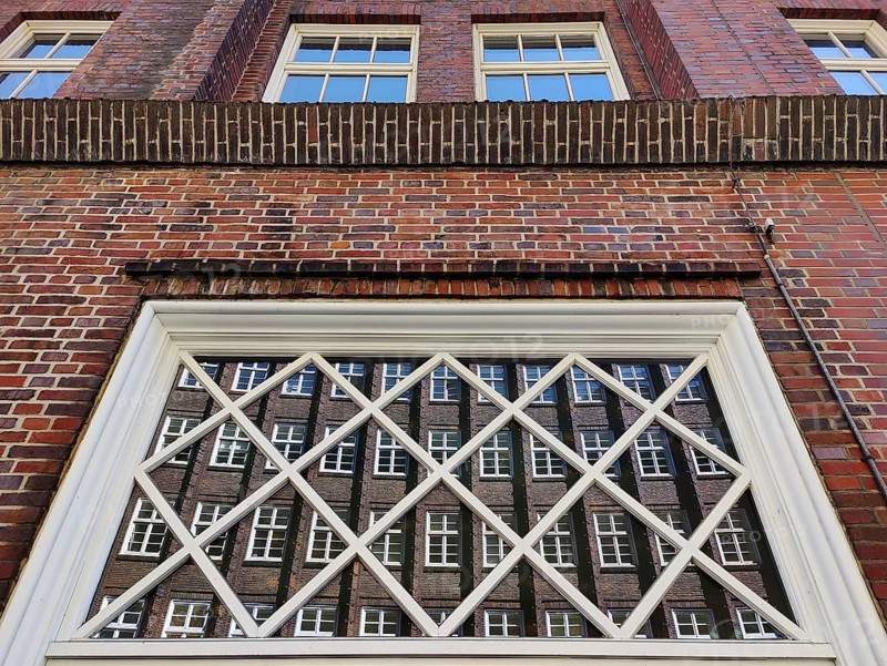 Reflection of the façade of the Sprinkenhof, Brick Expressionism, Kontorhausviertel, UNESCO World Heritage Site, Hamburg, Germany, Europe