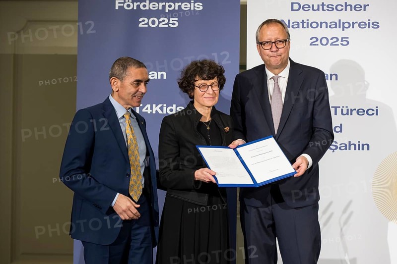 Ugur Sahin and Özlem Türeci (founders of Biontech SE) and Andreas Voßkuhle (President of the Senate of the German National Foundation) at the award ceremony for the German National Prize 2025 in the Französische Friedrichstadtkirche, Berlin, on 10 June 2025
