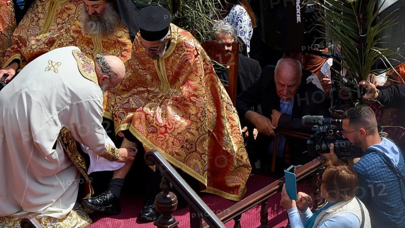 A priest in a golden robe blesses another, surrounded by cameras and a crowd, Orthodox ceremony, monks of St John's Monastery, ceremonial washing of feet, procession, Maundy Thursday, Megali Pempti, Chora, Patmos, Dodecanese, Greek Islands, Greece, Europe