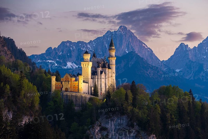 Fairytale castle against a mountain backdrop in the soft evening light, Neuschwanstein, Schwangau near Füssen, Ostallgäu district, Swabia, Bavaria, Germany, Europe