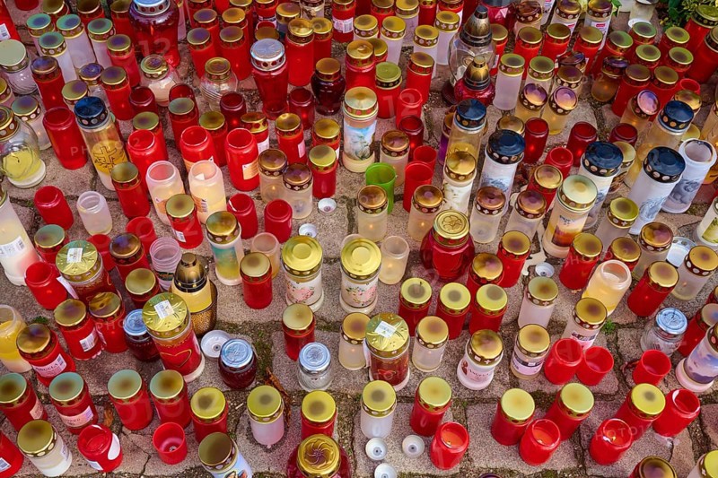 Many candles in different colours stand close together, creating a festive and contemplative atmosphere, cemetery, Mannheim, Baden-Württemberg, Germany, Europe