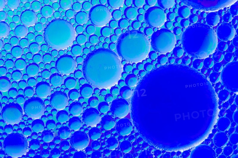 Colorful abstract macro background with oil drops in water
