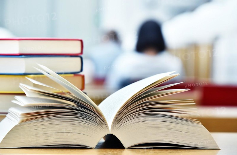 Books lying on the table in the public library