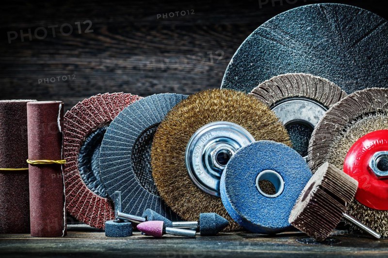 Large set of sanding tools on vintage wood background