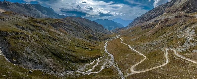 Ascent to Colle Sommeiller, also Col du Sommeiller, Mont-Cenis massif, Rough gravel road in the Piedmont Alps, Italian-French border area, Bardonecchia, Piedmont, Italy, Europe