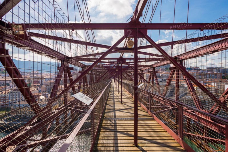 View along the gangway of the bridge. The Vizcaya Bridge, the worlds oldest transporter bridge, built in 1893, links the towns Portugalete and Las Arenas in the Basque Country, in the north of Spain