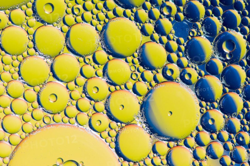 Colorful abstract macro background with oil drops in water