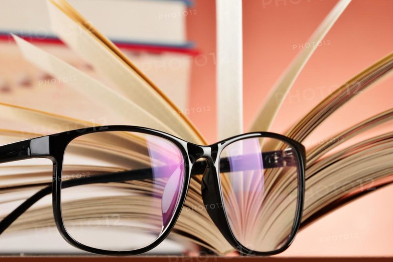 Composition with glasses and books on the table