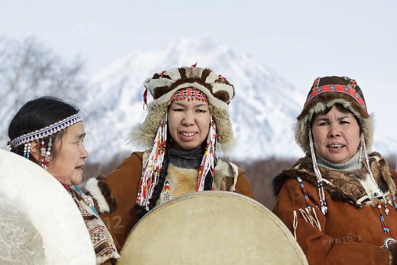 KAMCHATKA PENINSULA, RUSSIA, FEB 5, 2012: Womens dressed in the Koryak national costume with tambourines. Public concert Koryak National Folk Dance Group. Eurasia, Russian Far East, Kamchatka Region