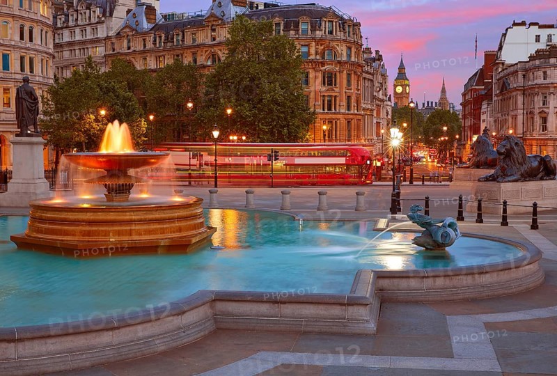 London Trafalgar Square fountain at sunset England
